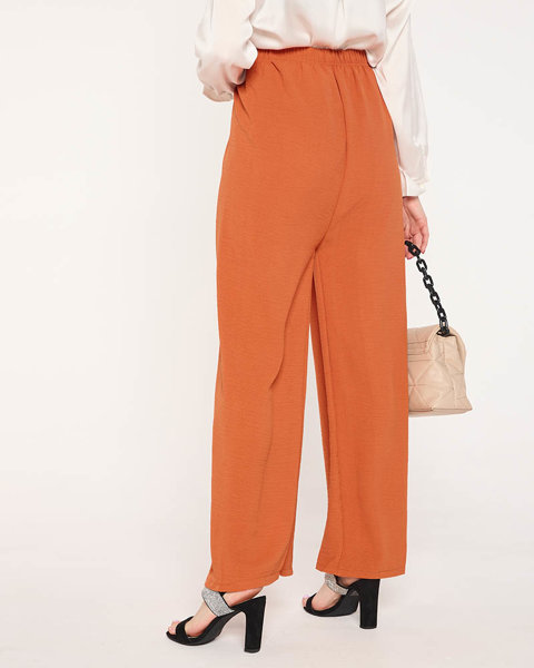 Светло-оранжевые широкие штаны палаццо