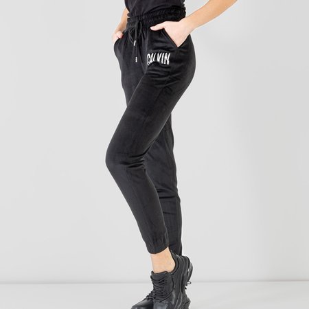 Чорні жіночі спортивні штани з срібним написом - Одяг