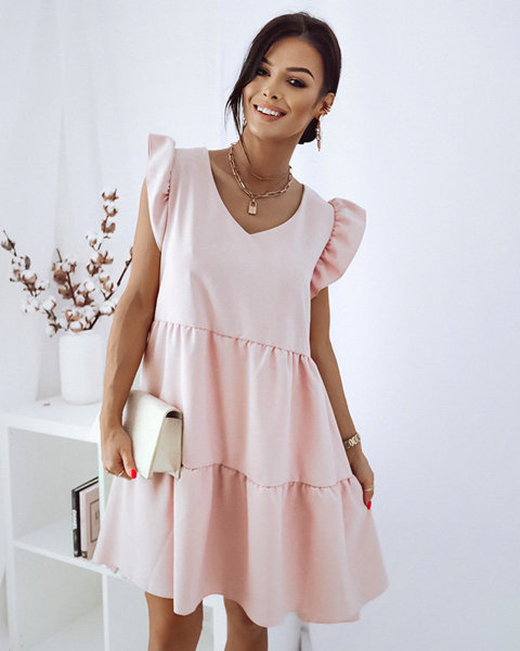 Пастельно рожева сукня з воланами