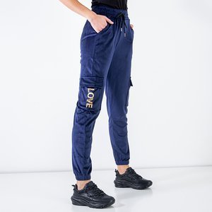 Жіночі темно-сині спортивні штани із золотими написами - Одяг